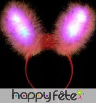 Oreilles de lapin rose lumineuses sur serre tête